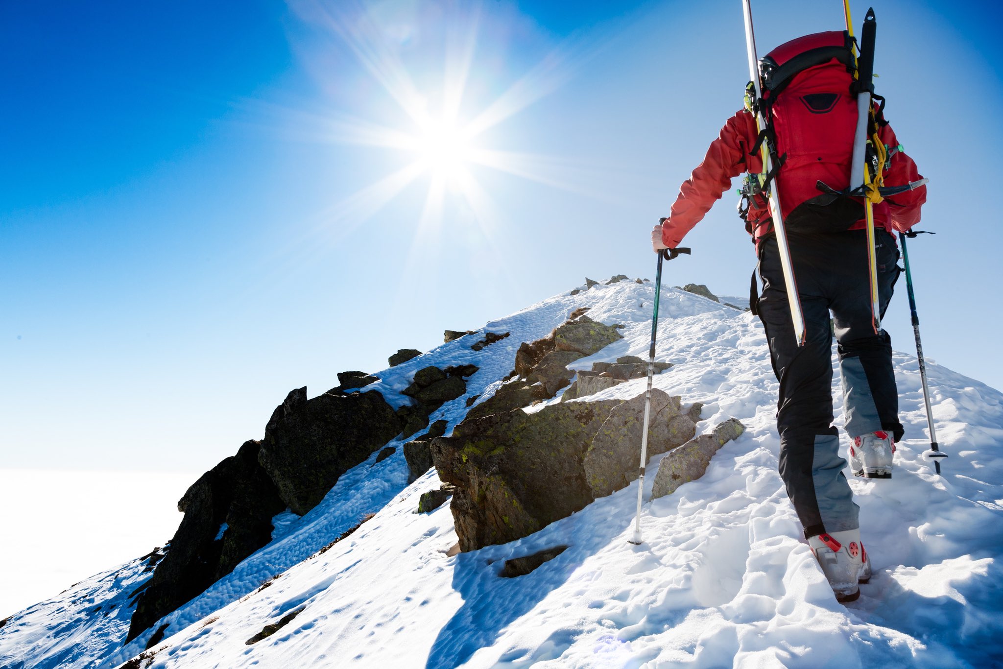 Hiker overlooking a mountain landscape